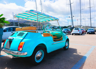 Golf cart in parking at Porto Cervo Sardinia