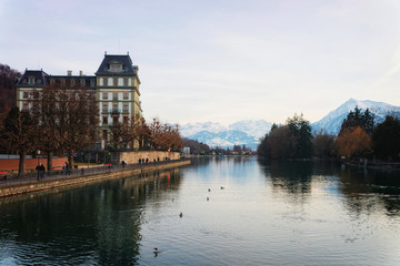 Naklejka premium Embankment and mountains in Old Town Thun Switzerland