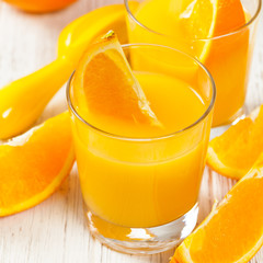 Orange Juice on wooden background. Selective focus.