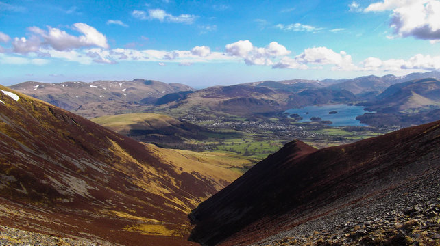 A valley leading to a lake surrounded by mountains in the Lake District