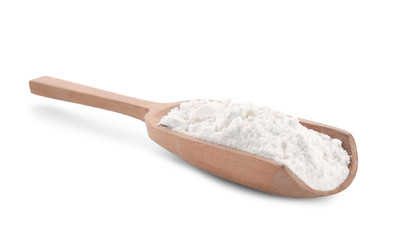 Wheat flour in wooden scoop on white background