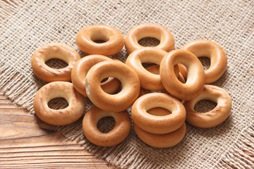 Dried crunchy bagels on sackcloth napkin