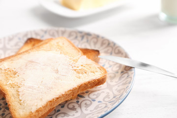 Tasty toasted bread with butter, closeup