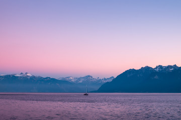 A moutian view from lake Burn during sunset in winter time, Swiss Alps, Lausanne Switzerland.