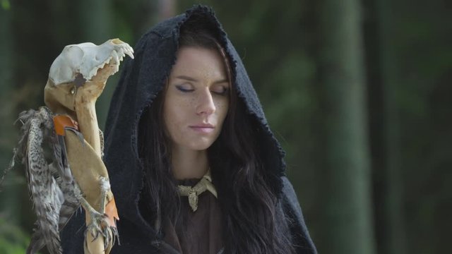 Woman with closed eyes holding a scepter