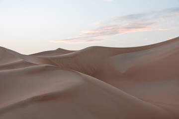 Beautiful remote sandy desert landscape of golden dunes in Liwa desert in Empty Quarter. Abu Dhabi, UAE.