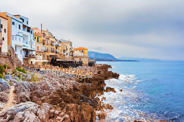 Fototapeta na wymiar Rocky Coast of Cefalu old town Sicily