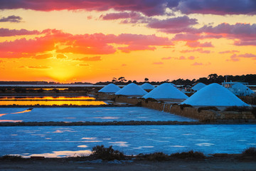 Sunset at salt evaporation pond Marsala Sicily - obrazy, fototapety, plakaty