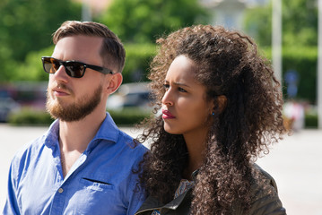 Young multiracial couple look serious and frightened Lithuania