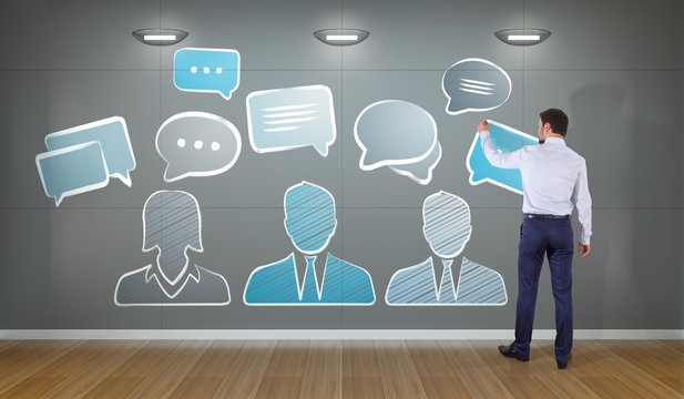 Businessman drawing discussion icons sketch on a wall 3D rendering