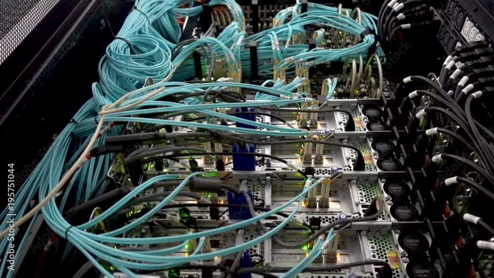 Aufkleber optical fiber. severs computer in a rack at the large data center. optical server. commutator. flash