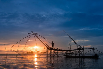 Fototapeta na wymiar Fisherman using huge fishing equipment called 'Yor' in Phatthalung, southern Thailand