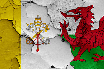 flag of Vatican and Wales painted on cracked wall
