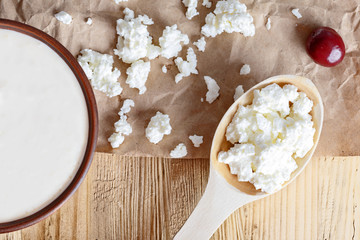 Cottage cheese on a wooden table close up