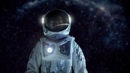 Courageous Astronaut in the Space Suit Stands on the Alien Planet. Milky Way Galaxy Behind Him. Exploring Newly Discovered Planet. Space Travel and Extraterrestrial Colonization Concept. © Gorodenkoff
