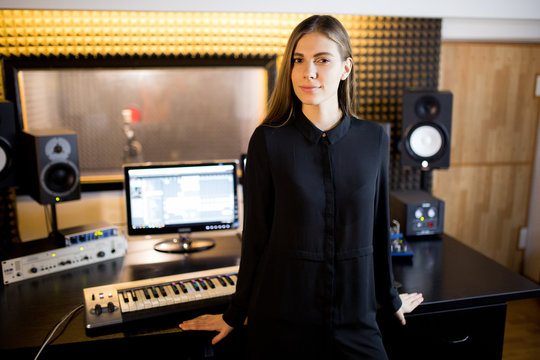 A woman in a recording studio musician.