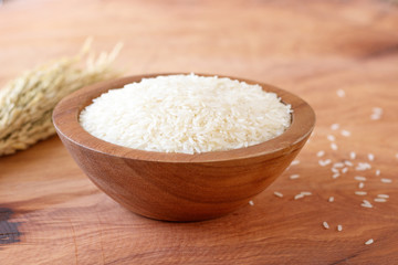 Fototapeta na wymiar White rice in bowl on wooden background.