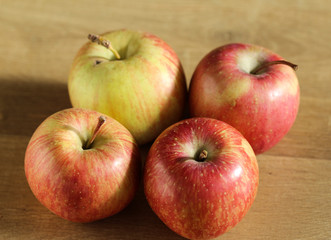 fresh red and yellow Japanese fuji apples on wooden background