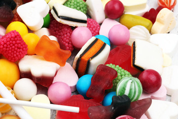 candies with jelly and sugar. colorful array of different childs sweets and treats