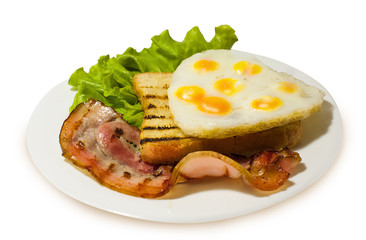 Grilled toast with bacon and fried quail eggs on the lettuce. White isolated background.