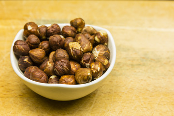 Bowl with shelled hazelnuts.