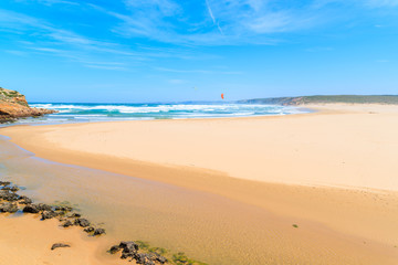 View of beautiful Praia da Bordeira beach, popular place to do kite surfing, Algarve, Portugal