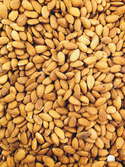 Closeup of whole almond nuts for background.
