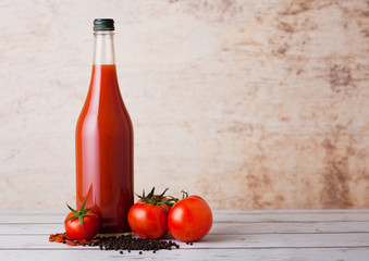 Bottle of spicy tomato juice with black pepper