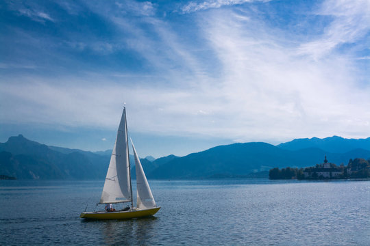 Sailboat on lake Traunsee in the mountains of the Alps, Austria