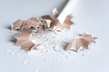 White pencil with shavings, isolated on white background