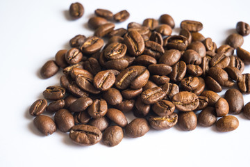 Coffee beans on white background, close up