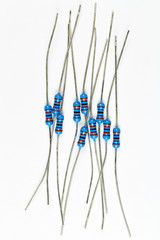 Blue resistors in bulk on a white background