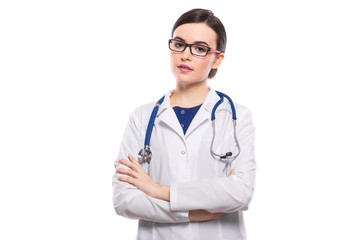 Fototapeta premium Young woman doctor with crossed arms with stethoscope in white uniform on white background