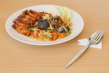 Som tum Thai papaya salad with barbecue chicken.