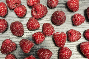 Top view of a table with raspberries.