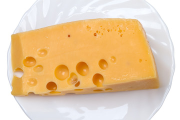 Piece of cheese on a white plate