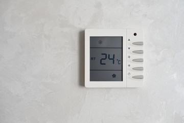 The temperature regulator of the air conditioner is built into the wall. Temperature controller...