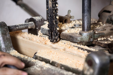 Carpenter using electric saw
