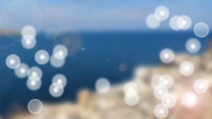 Abstract bokeh lights on blue backround from sea and sky