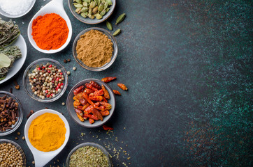 Various spices in glass bowls