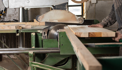 Carpenter using electric saw
