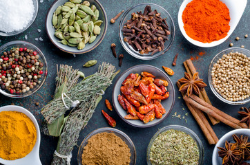 Various spices in glass bowls