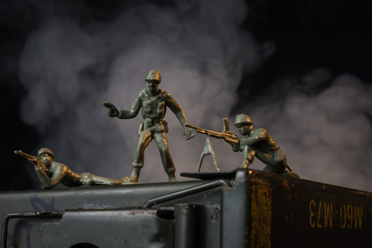 Toy soldiers on ammunition can