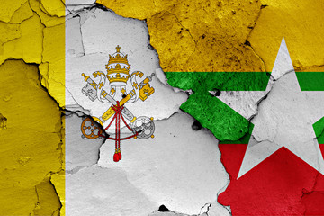 flag of Vatican and Myanmar painted on cracked wall