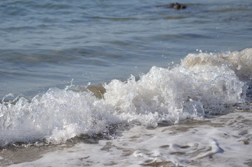Zoom on the beach from the mediterranean sea (italy)