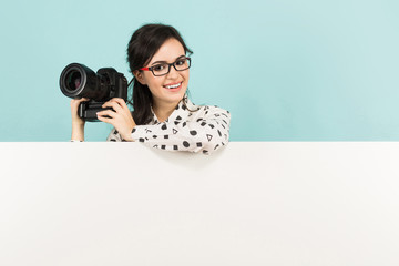 Young woman with camera