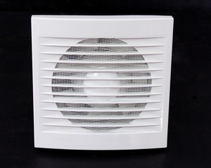 Wall electric extractor fan for bathroom. Closeup