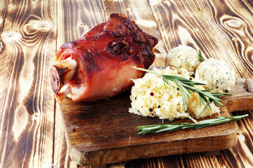Roasted pork knuckle. Ham and bacon are popular foods in the west. German Schweinshaxe or Haxe