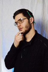 student with glasses with a book