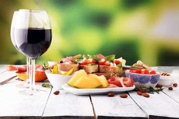 Italian antipasti wine snacks set. Cheese variety, Mediterranean olives, pickles, Prosciutto di...